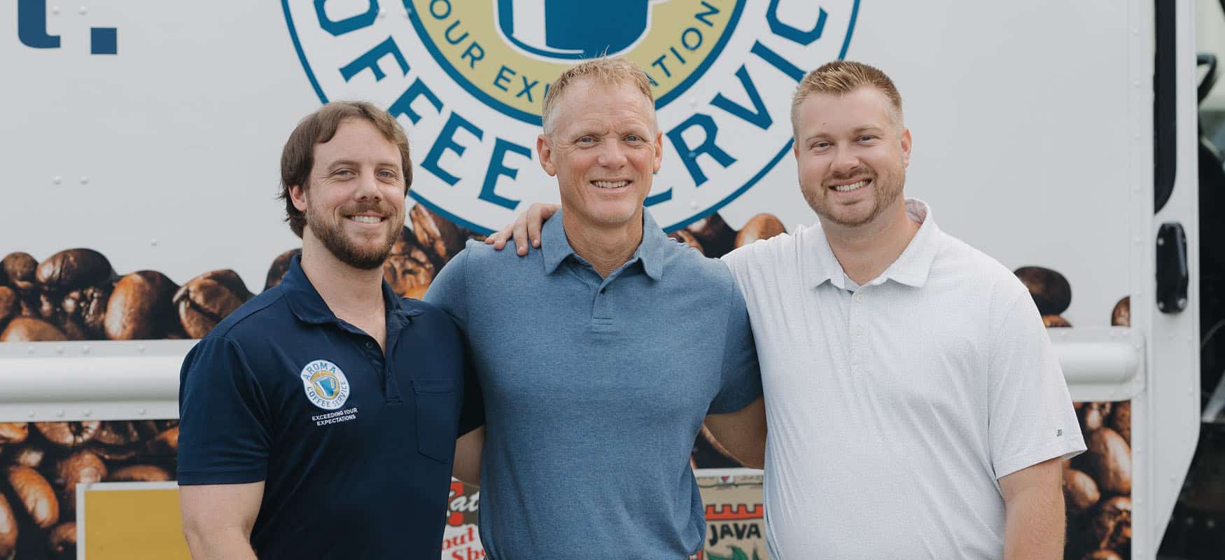 WHO RUNS AROMA COFFEE SERVICES? 3 employees in front of aroma coffee service truck.